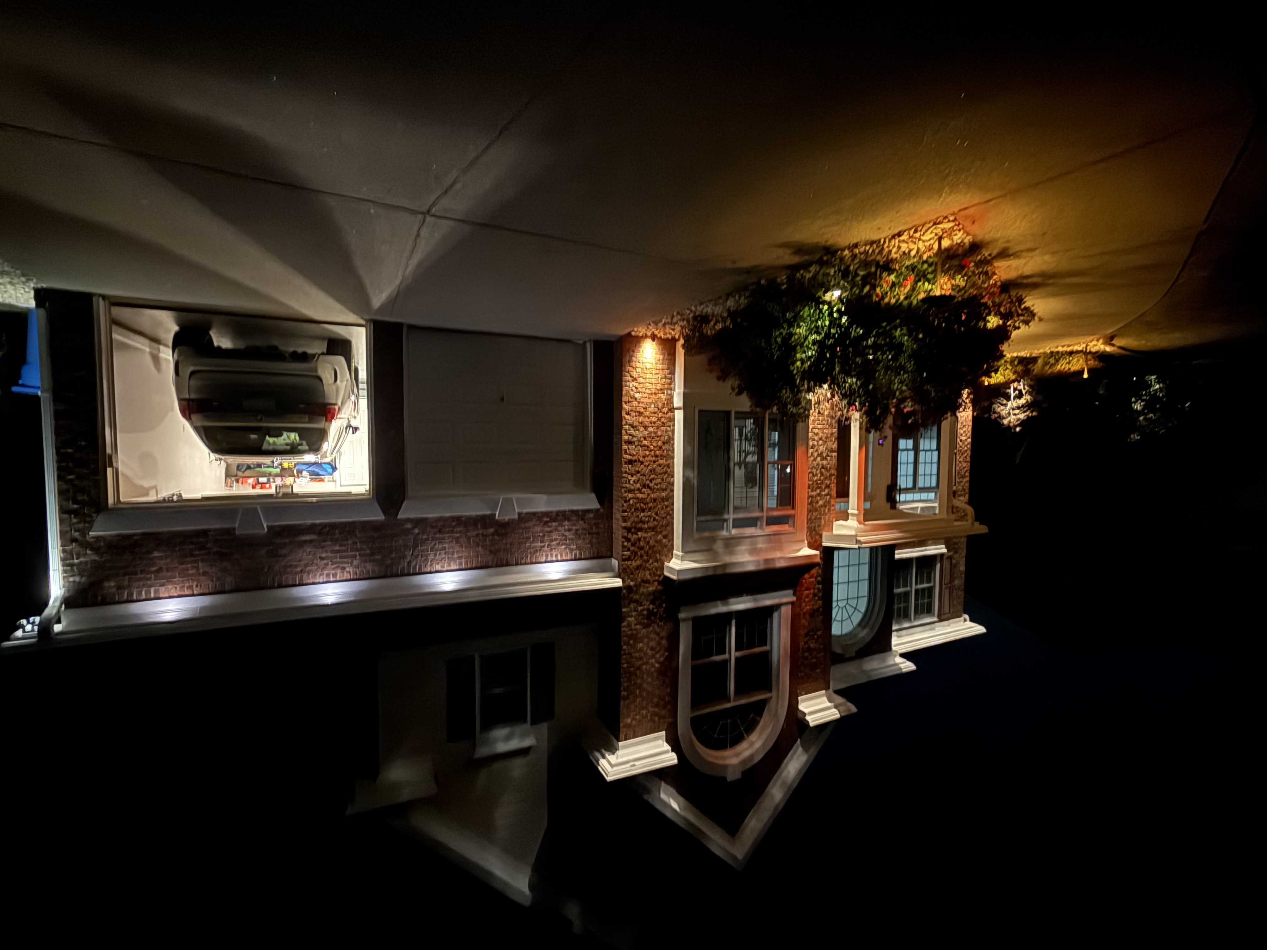 Residential exterior accent lighting on brick home